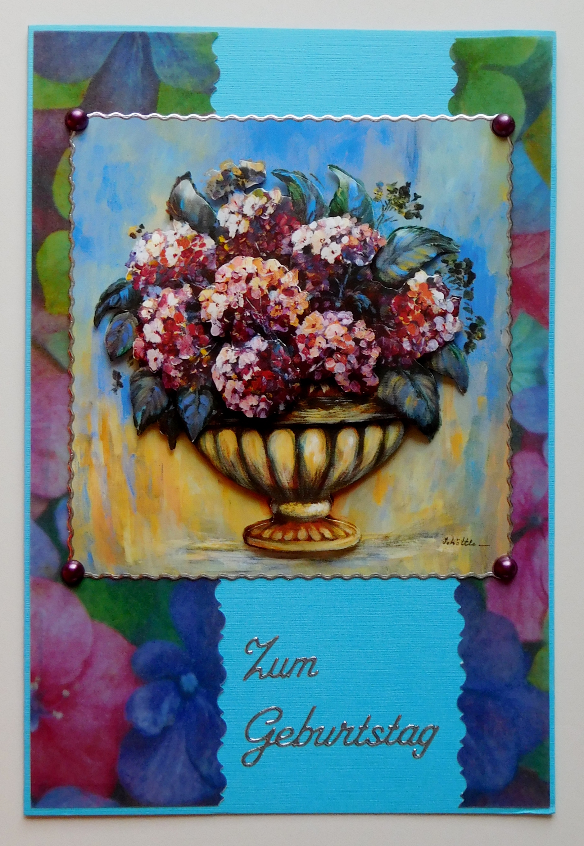 Azurblaue Geburtstagskarte mit rosa Hortensienmotiv und silbernem Schriftzug